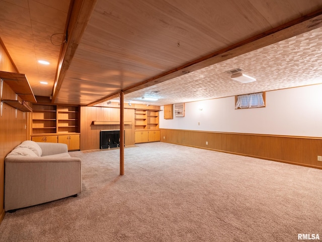 204 Ivanhoe Way, Bloomington, IL 61701 - finished basement with wooden walls, a wainscoted wall, carpet, a fireplace, and wooden ceiling