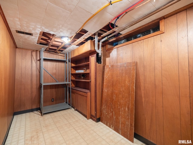 204 Ivanhoe Way, Bloomington, IL 61701 - basement featuring tile patterned floors and wood walls