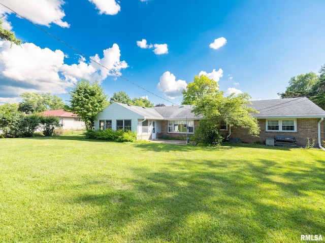 204 Ivanhoe Way, Bloomington, IL 61701 - single story home with a front yard and brick siding