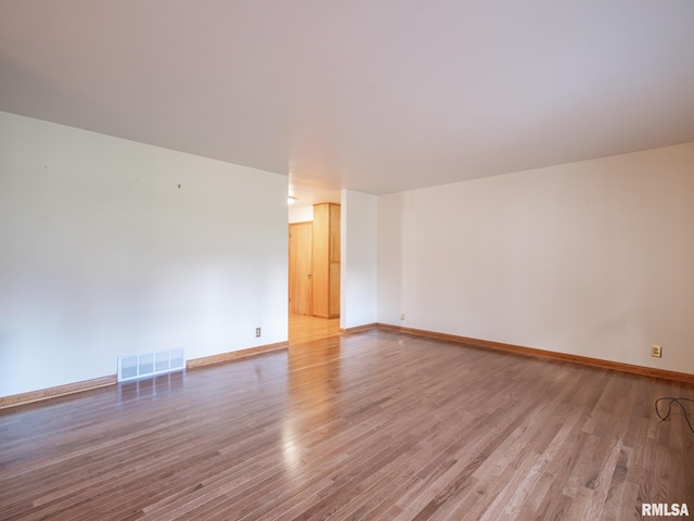 204 Ivanhoe Way, Bloomington, IL 61701 - unfurnished room with light wood-type flooring and baseboards