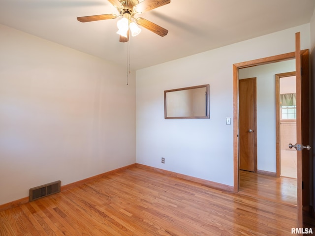 204 Ivanhoe Way, Bloomington, IL 61701 - empty room with light wood-style flooring and a ceiling fan