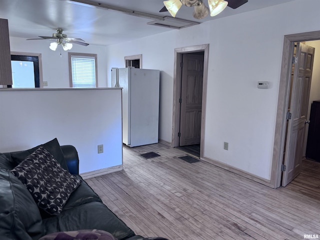 1807 N 5th St, Chillicothe, IL 61523 - living area with ceiling fan and light wood-style floors