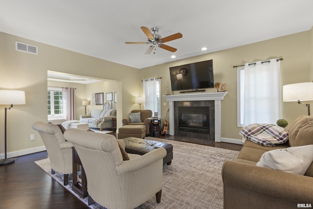 10615 N Collett Rd, Peoria, IL 61615 - living room featuring a fireplace, a ceiling fan, dark wood-type flooring, and recessed lighting