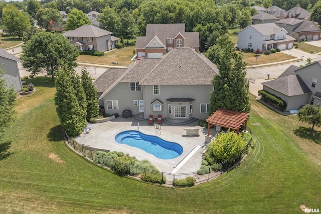 10615 N Collett Rd, Peoria, IL 61615 - back of property featuring roof with shingles, a patio area, and a residential view