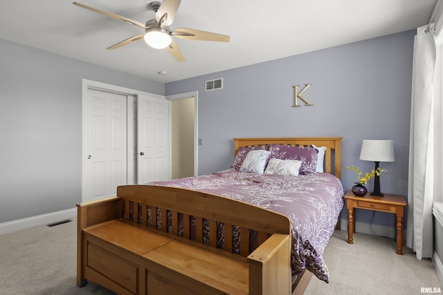10615 N Collett Rd, Peoria, IL 61615 - bedroom featuring light carpet, a ceiling fan, and a closet