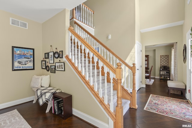 10615 N Collett Rd, Peoria, IL 61615 - staircase featuring a high ceiling and wood finished floors