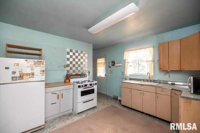 1425 Arthur St, Pekin, IL 61554 - kitchen with white appliances, dark speckled floor, and light countertops