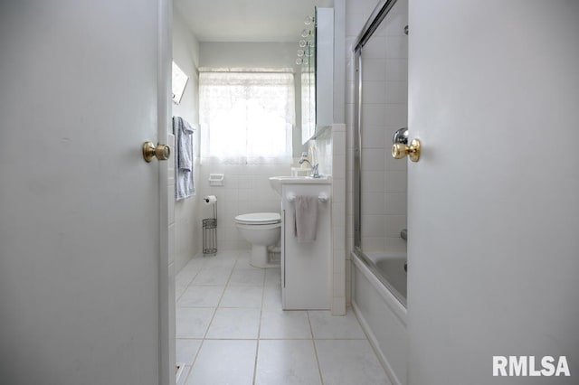 1425 Arthur St, Pekin, IL 61554 - full bath with tile patterned flooring, shower / tub combination, and tile walls