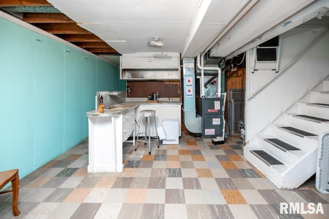 1425 Arthur St, Pekin, IL 61554 - basement featuring light flooring, stairs, and heating unit