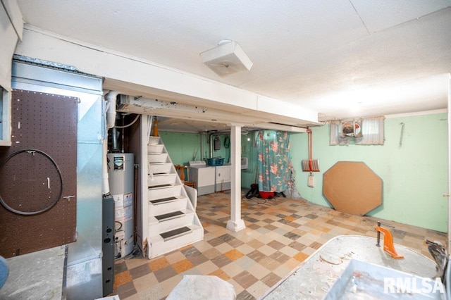 1425 Arthur St, Pekin, IL 61554 - finished basement featuring washer / clothes dryer, tile patterned floors, gas water heater, and stairs