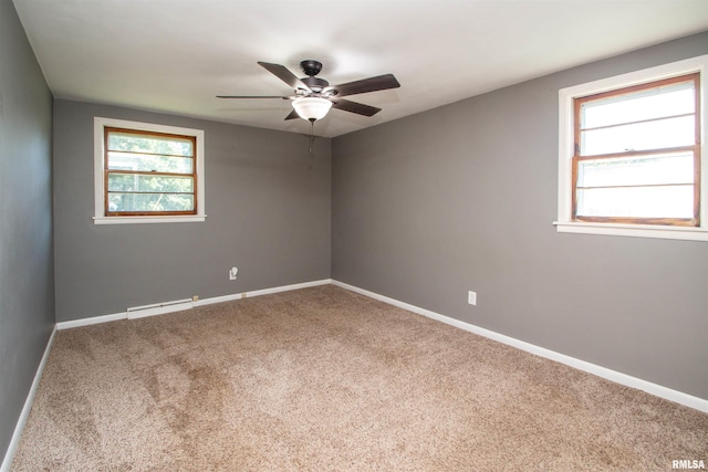 416 W Maple St, Chillicothe, IL 61523 - spare room with a ceiling fan, healthy amount of natural light, a baseboard radiator, and carpet