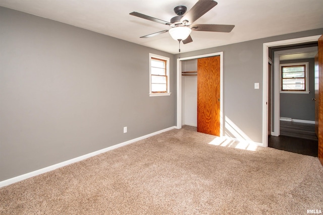 416 W Maple St, Chillicothe, IL 61523 - unfurnished bedroom featuring carpet floors, a closet, and a ceiling fan