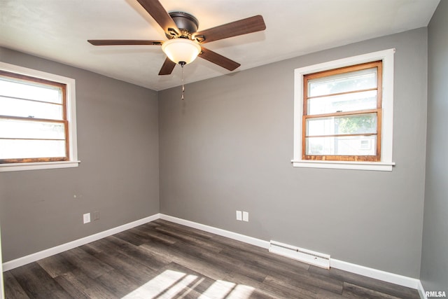 416 W Maple St, Chillicothe, IL 61523 - unfurnished room with baseboard heating, plenty of natural light, a ceiling fan, and dark wood finished floors
