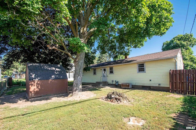 416 W Maple St, Chillicothe, IL 61523 - back of property featuring a storage shed and a fire pit