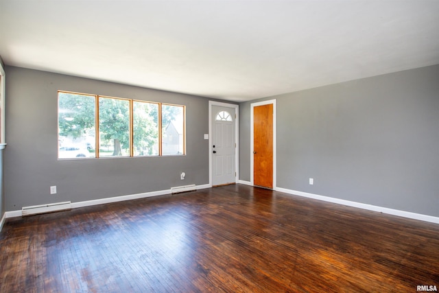 416 W Maple St, Chillicothe, IL 61523 - unfurnished room featuring baseboard heating and dark wood-style floors