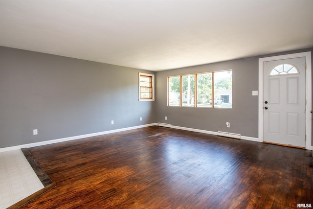 416 W Maple St, Chillicothe, IL 61523 - foyer entrance featuring a baseboard heating unit and dark wood-style flooring
