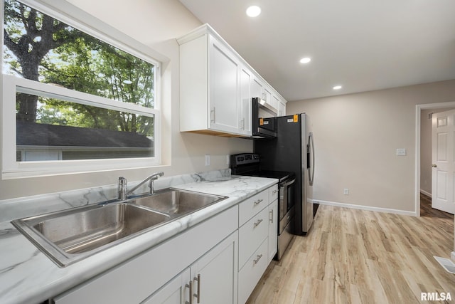 117 Hazel Ct, Creve Coeur, IL 61610 - kitchen with stainless steel appliances, light wood finished floors, white cabinets, and recessed lighting