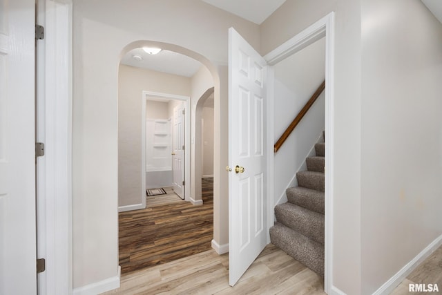117 Hazel Ct, Creve Coeur, IL 61610 - stairway featuring wood finished floors and arched walkways