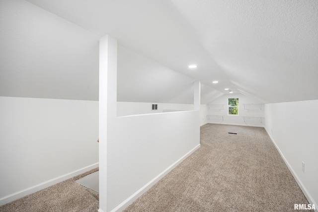 117 Hazel Ct, Creve Coeur, IL 61610 - additional living space with vaulted ceiling, carpet, and recessed lighting