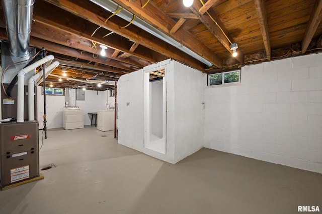 117 Hazel Ct, Creve Coeur, IL 61610 - below grade area with washer and clothes dryer, electric panel, healthy amount of natural light, and heating unit
