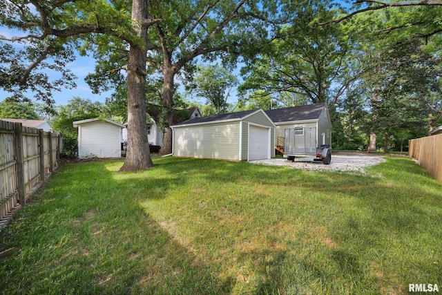 117 Hazel Ct, Creve Coeur, IL 61610 - view of yard featuring an outbuilding and a garage