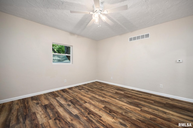 117 Hazel Ct, Creve Coeur, IL 61610 - spare room with dark wood-type flooring, a ceiling fan, and a textured ceiling