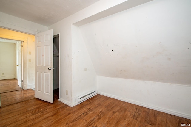 2211 N Bigelow St, Peoria, IL 61604 - bonus room featuring a baseboard heating unit and wood finished floors