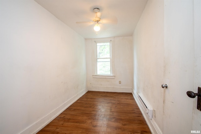 2211 N Bigelow St, Peoria, IL 61604 - spare room featuring a baseboard radiator, wood finished floors, and a ceiling fan