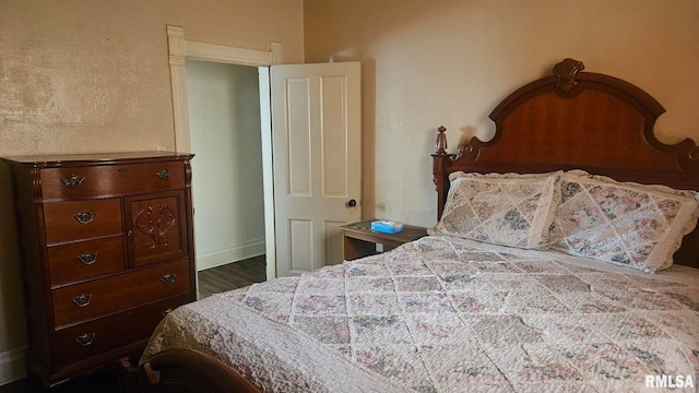 658 E Maple St, Canton, IL 61520 - bedroom with baseboards