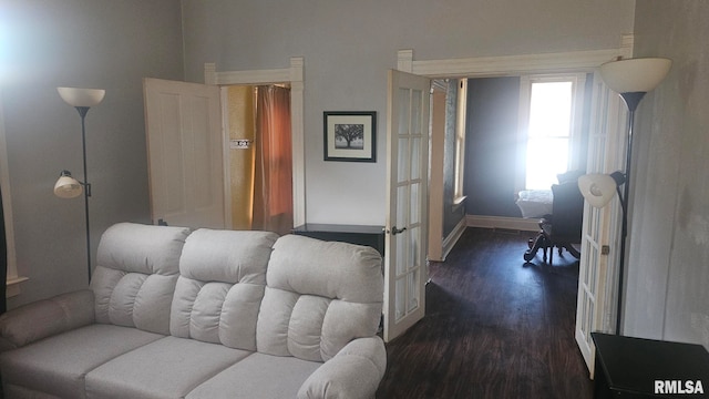 658 E Maple St, Canton, IL 61520 - living room with french doors and dark wood finished floors
