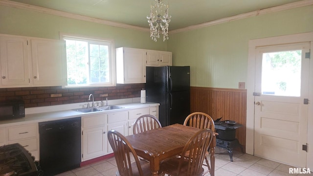 658 E Maple St, Canton, IL 61520 - kitchen featuring black appliances, light tile patterned floors, crown molding, white cabinets, and light countertops