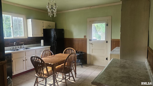 658 E Maple St, Canton, IL 61520 - kitchen with black appliances, ornamental molding, wainscoting, white cabinetry, and light tile patterned floors
