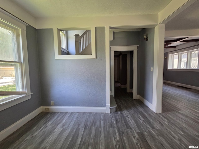 1310 N Sheridan Rd, Peoria, IL 61606 - unfurnished room featuring wood finished floors and beamed ceiling