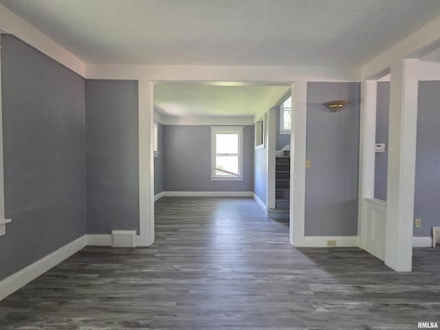 1310 N Sheridan Rd, Peoria, IL 61606 - empty room with stairs and dark wood finished floors