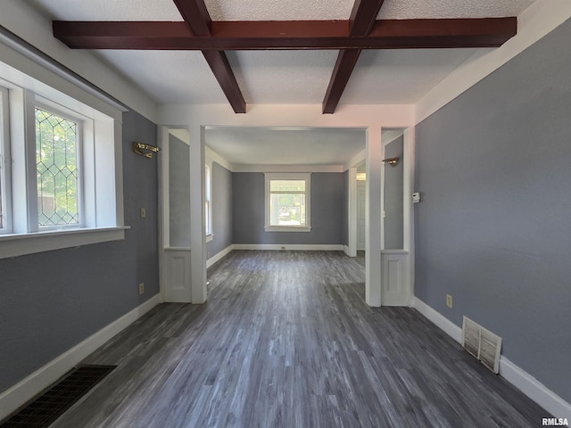 1310 N Sheridan Rd, Peoria, IL 61606 - spare room featuring beam ceiling and dark wood-type flooring