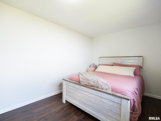 6110 N Idlewhile Dr, Peoria, IL 61614 - bedroom featuring baseboards and dark wood-style floors