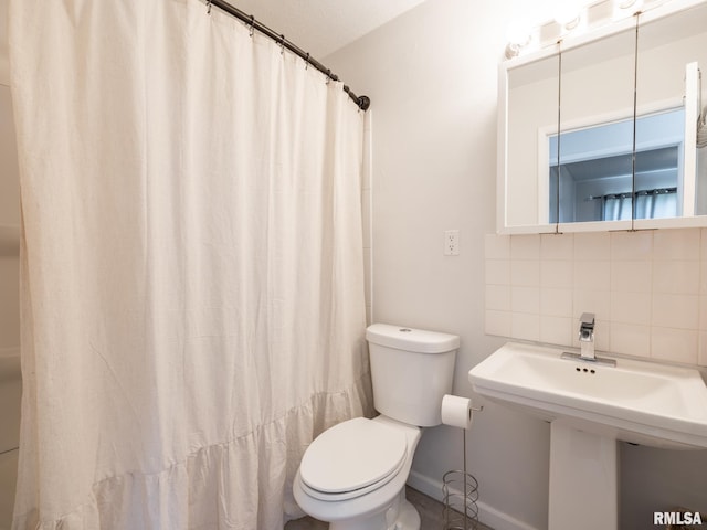 6110 N Idlewhile Dr, Peoria, IL 61614 - full bathroom featuring decorative backsplash and a shower with shower curtain
