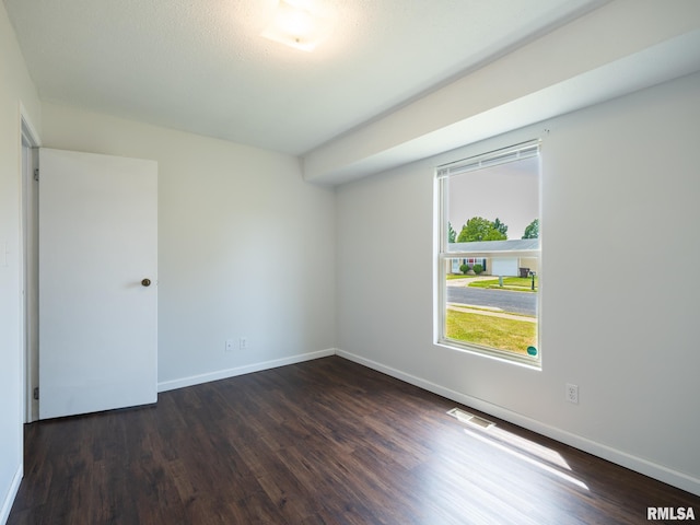 6110 N Idlewhile Dr, Peoria, IL 61614 - spare room with wood finished floors and baseboards