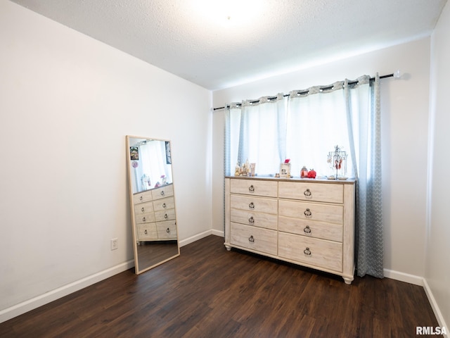 6110 N Idlewhile Dr, Peoria, IL 61614 - bedroom with dark wood-style floors and baseboards