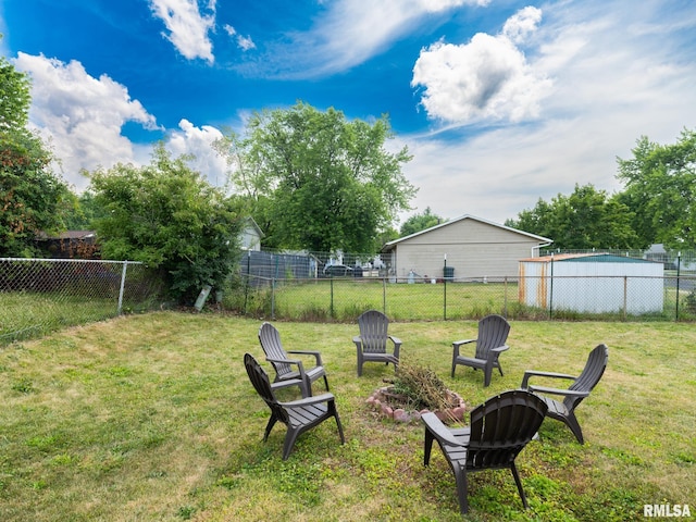 6110 N Idlewhile Dr, Peoria, IL 61614 - fenced backyard featuring a fire pit