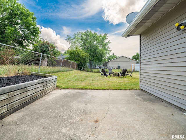 6110 N Idlewhile Dr, Peoria, IL 61614 - fenced backyard with a patio area and a fire pit