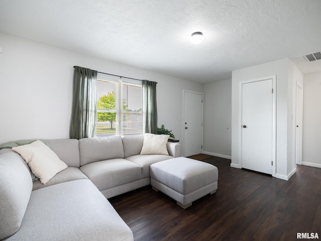 6110 N Idlewhile Dr, Peoria, IL 61614 - living area featuring dark wood-type flooring and a textured ceiling