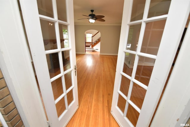 300 E Embert Pl, Peoria, IL 61603 - corridor featuring arched walkways, crown molding, wood finished floors, and french doors