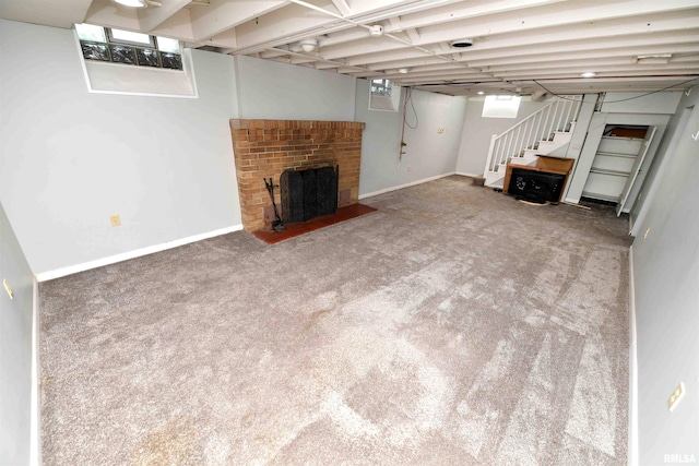 300 E Embert Pl, Peoria, IL 61603 - below grade area with carpet floors, stairway, and a brick fireplace