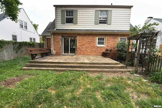 300 E Embert Pl, Peoria, IL 61603 - rear view of property featuring brick siding, a fenced backyard, and a wooden deck