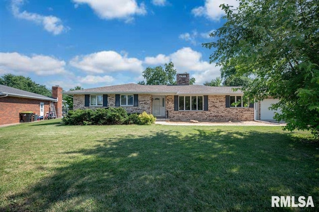 470 E Hazelwood St, Morton, IL 61550 - single story home with brick siding, a chimney, a front lawn, and an attached garage