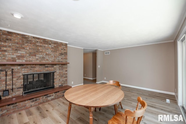 470 E Hazelwood St, Morton, IL 61550 - living room with wood finished floors, a fireplace, and crown molding