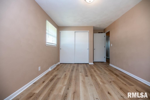 470 E Hazelwood St, Morton, IL 61550 - unfurnished bedroom featuring a closet and wood finished floors
