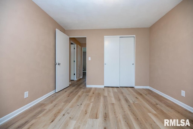 470 E Hazelwood St, Morton, IL 61550 - unfurnished bedroom featuring wood finished floors and a closet