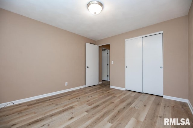 470 E Hazelwood St, Morton, IL 61550 - unfurnished bedroom with wood finished floors and a closet